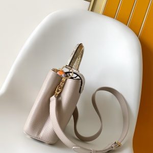 Alternative view of p130021 x 13.6 x 8 (cm) (Length x Height x Width) 27 x 17.3 x 9 (cm) (Length x Height x Width) • Taurillon calf leather • Taurillon calf leather trim • Calf leather lining • Metal hardware • Flap can be positioned inside or outside • Compartment features zippered pocket and slip pocket • Metal studs • Holds smartphone, LV Vertical wallet, headphones,keys, and lipstick • Shoulder strap: detachable, adjustable • Half strap length: 46.5 cm • Adjustable half strap length: 55.0 cm • Handle: single handle